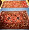 Two red ground rugs 190 x 107cm and 155 x 103cm                                                                                        