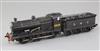 A 4F 0-6-0 LMS tender locomotive, number 3910, black livery, 3 rail with skate, overall 37cm                                           