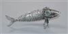 A Spanish white metal articulated model of a fish with green cabochon eyes, 12.4cm.                                                    