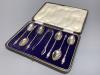 A cased set of six George V silver apostle teaspoons and a pair of sugar tongs, Cooper Brothers & Sons, Sheffield, 1921.                                                                                                    