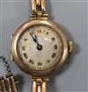 A lady's early 20th century 9ct. gold manual wind wrist watch on a 9ct gold bracelet.                                                  