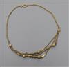 A late Victorian 9ct gold triple swag, bar and sphere necklace, 43cm.                                                                  