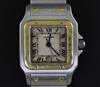 A gentleman's 1990's stainless steel and gold Cartier Santos quartz wrist watch,                                                       