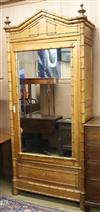 A faux bamboo mirrored cabinet with shelves W.100cm approx.                                                                            