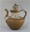 A Tibetan copper and silver teapot, 19th century, H. 26.5cm                                                                            