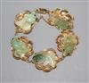 A 14k yellow metal and jade bracelet, each link mounted with jade carved as goldfish.                                                  