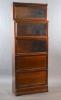 A Globe Wernicke mahogany sectional bookcase, W.87cm D.37cm H.216cm.                                                                                                                                                        