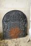 A cast iron fireback, width 55cm, height 68cm                                                                                                                                                                               