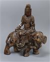 A Chinese wood carving of Guanyin on elephant, Qing height 24cm                                                                        