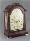 A late 18th century mahogany table clock, height 16.5in.                                                                               