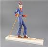 A William Goebel Art Deco pottery figure of a woman skier, height 32.5cm, ski poles re-attached                                        