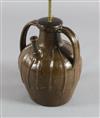 A French medieval brown spouted jar, 13.5in.                                                                                           