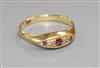 An 18ct gold, small five stone ruby and diamond ring, size Q/R.                                                                        