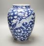 A Chinese blue and white ovoid jar, 19th/20th century, painted with dragons amid flowers and foliage, 33 cms high.                                                                                                          