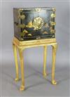 An early 18th century Japanese black lacquer cabinet, cabinet W.1ft 7in. D.1ft H.1ft 4in. Overall W.1ft 9in. D.1ft 3in. H.3ft 6.5in.   