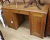 An Art Deco oak pedestal desk W.130cm                                                                                                  