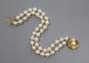 A modern double strand cultured pearl bracelet with a 9ct and cultured pearl clasp, 18cm                                                                                                                                    