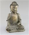 A Chinese bronze seated figure of Buddha Shakyamuni, 17th century, H. 25cm, small losses                                               