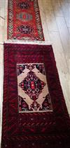 Two red ground rugs 144 x 78cm and 117 x 62cm                                                                                          