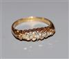 An early 20th century 18ct gold and graduated five stone diamond half hoop ring, size M.                                               