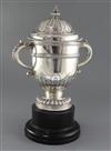 A George VI silver two handled trophy cup and cover by William Comyns & Sons Ltd, 78 oz.                                               
