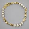 A yellow metal and baroque pearl set fancy link bracelet, 18cm                                                                                                                                                              