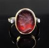 A Georgian yellow metal and oval red intaglio foil backed? ring with old cut diamond set shoulders, size L.                            