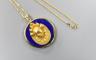 An Egyptian yellow metal earring from the Josephine Dubois Collection, now mounted on a 14l and lapis lazuli circular pendant, with a 14k chain                                                                             