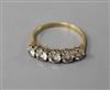 A yellow metal and graduated five stone diamond half hoop ring, size O.                                                                