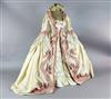 Countess Almaviva's costume for The Marriage of Figaro. A cream silk dress, under skirt, looped petticoat and blonde                   