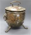 A silvered copper lidded coal scuttle, paw feet and lion handles height 43cm                                                           