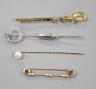 A French white metal (poincon mark for platinum) and diamond set tie pin, 64mm, gross 3.4 grams, a 15ct and enamel(a.f.) sword brooch, gross 4.7 grams and toe 9ct pins, one with cultured pearl, gross 3 grams.            