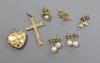 A 9ct gold cross pendant, three pairs of 9ct ear studs, one odd ear stud and a 9ct gold heart pendant                                                                                                                       