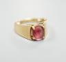 A 14k yellow metal and oval facet cut pink tourmaline? set ring, size P/Q.                                                                                                                                                  