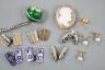 An early 20th century French white and yellow metal, green enamel(a.f.) set pomander, 19mm, on a white metal chain, three French (18ct poincon mark) and baroque pearl set dress studs, gross 3.5 grams, a diamond set 15ct 