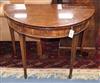 A George III inlaid mahogany demi-lune folding card table                                                                              