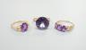 Two modern 14k yellow metal and gem set rings, including amethyst, size N, gross weight 7.4 grams and a similar 10k and three stone amethyst ring, size Q/R, gross 2.3 grams.                                               