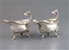 A pair of early George III silver sauceboats with flying scroll handles, maker, F.M, (unidentified Grimwades), London, 1766, 20 oz.    