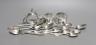 A set of six late Victorian silver coffee spoons, Sheffield, 1884, a set of six early 20th century French white metal teaspoons, two silver napkin rings and an Australian E.P.N.S. napkin ring.                            