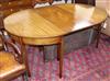 A George III mahogany D-end extending dining table, L.160cm extended, two spare leaves, no clips                                       