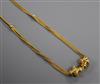 A late 19th/early 20th French 18ct two colour yellow metal double and triple chain necklace with sliding turned batons, 46cm.          