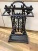 A cast iron umbrella stand                                                                                                                                                                                                  