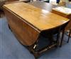 A 17th century style oak double gateleg table W.190cm                                                                                  