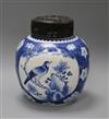 A Chinese blue and white prunus jar, wood cover, 19th century overall height 24cm                                                      