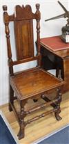 A 17th century oak wood seat dining chair                                                                                              