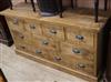 A modern oak chest of nine drawers W.152cm                                                                                             