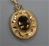 An Austrian yellow metal and gem set oval pendant, 40mm.                                                                               