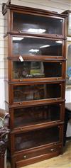 A Wernicke System Elastic serpentine mahogany six section bookcase, c.1895 W.91cm                                                      