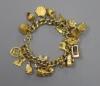 A 9ct curb link charm bracelet hung with twenty one assorted mainly 9ct gold charms                                                                                                                                         