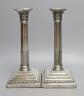 A pair of late Victorian silver Corinthian column candlesticks, maker's mark rubbed, London, 1890, height 27.7cm, weighted.                                                                                                 